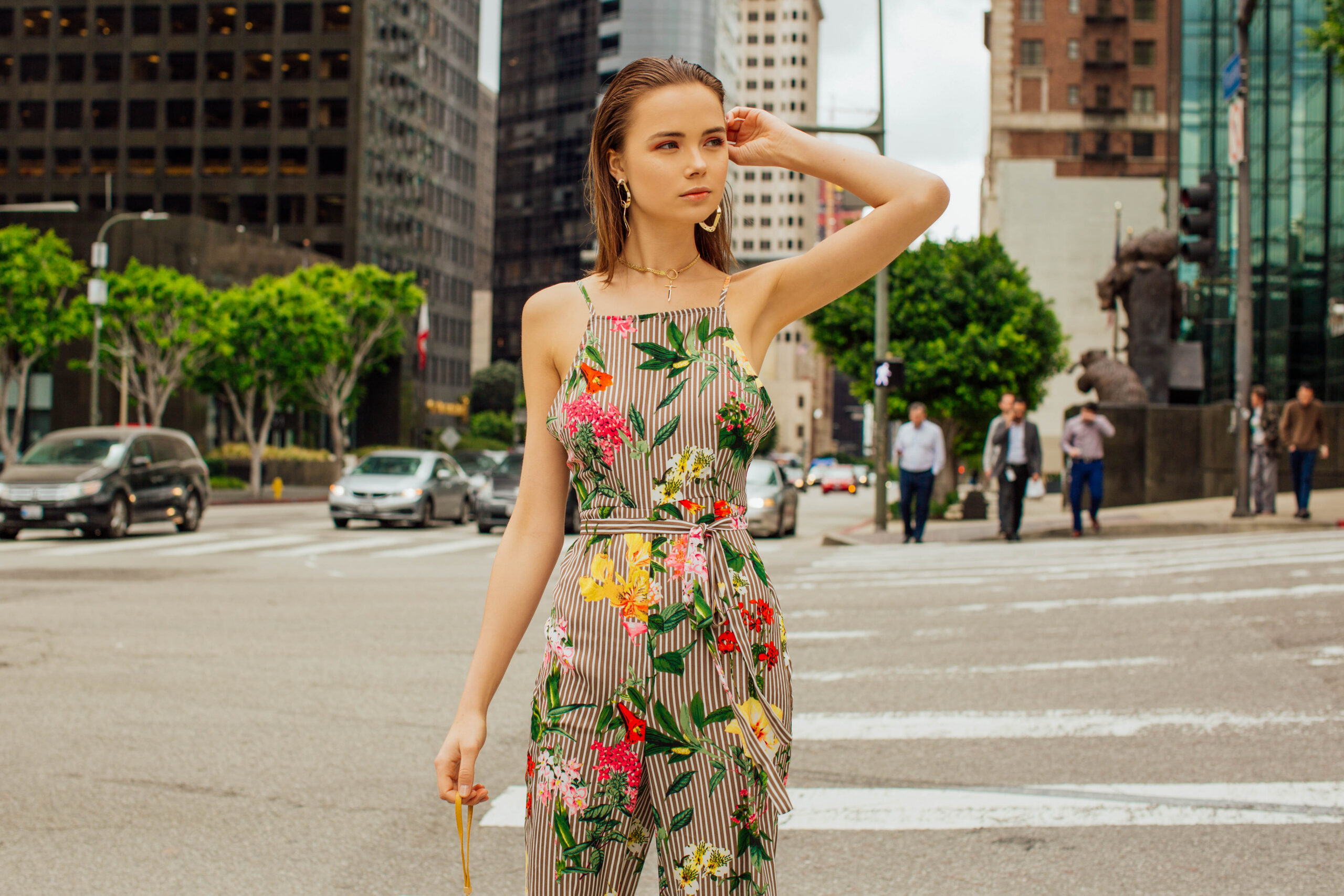 Lifestyle photo of a woman in floral dress in the city