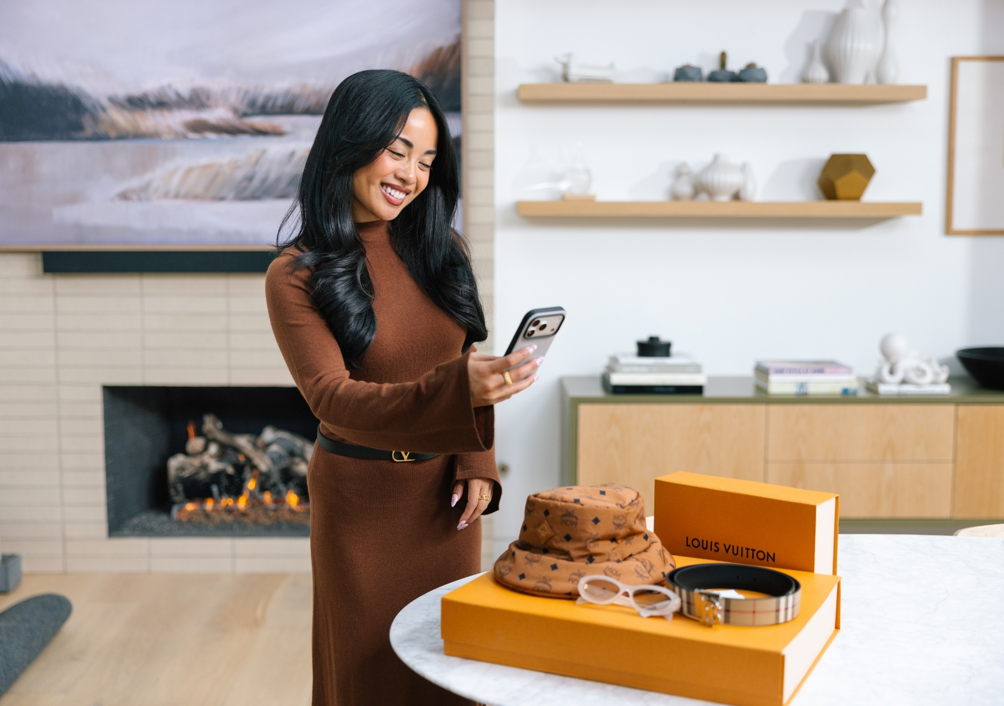 A woman verifying authentic designer items with Real Authentication